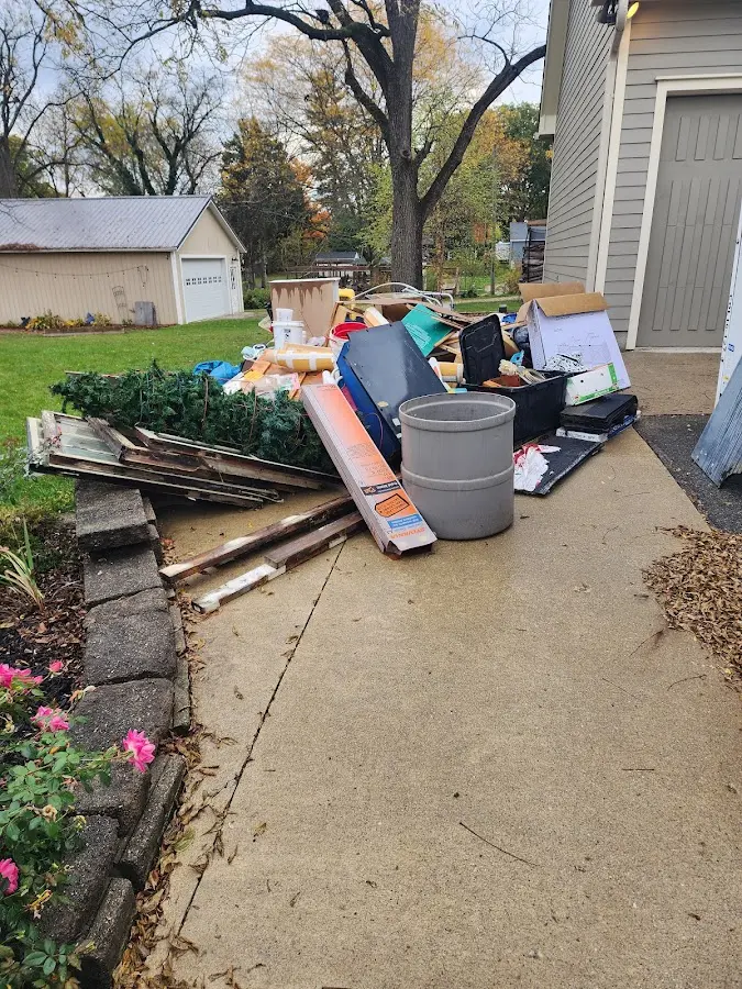 Dumpster being loaded with debris for Residential Dumpster Rental in Seffner
